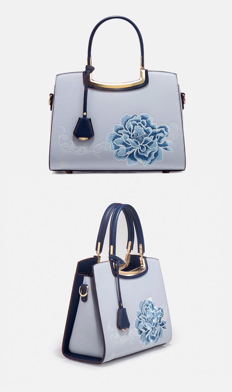 Ladies Elegant Burgundy Handbag with Floral Embroidery And Gold-Tone Hardware